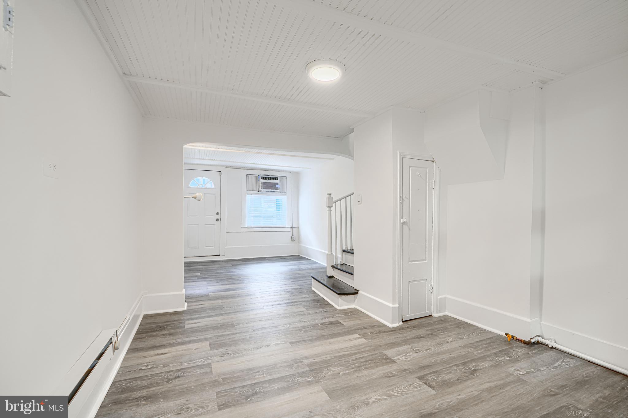 2015 Spark Court Baltimore, MD 21231 - Photo 3 of 12 an empty room with wooden floor & windows