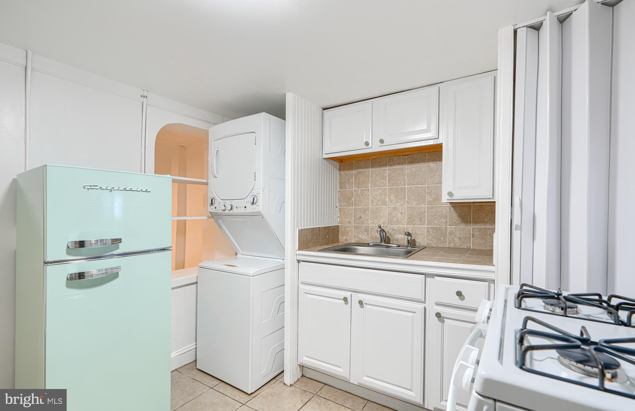 2015 Spark Court Baltimore, MD 21231 - Photo 7 of 12 a kitchen with a sink a refrigerator and cabinets