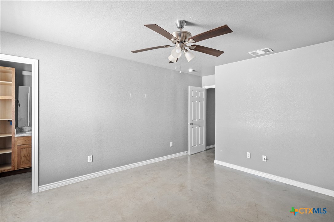 1409 Natchez Trail, Unit A Harker Heights, TX 76548 - Photo 17 of 25 an empty room with closet and a chandelier fan