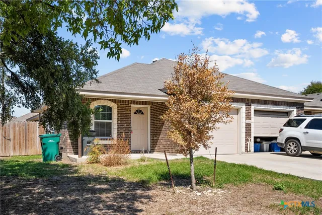a car parked in front of a house