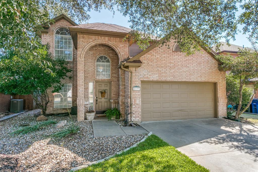 2133 Rim Rock Drive Keller, TX 76248 - Photo 2 of 37 Traditional-style house featuring brick siding, concrete driveway, an attached garage, and roof with shingles