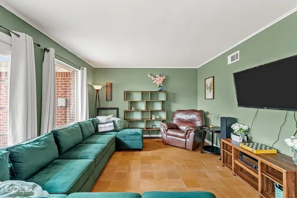 a living room with furniture and a flat screen tv