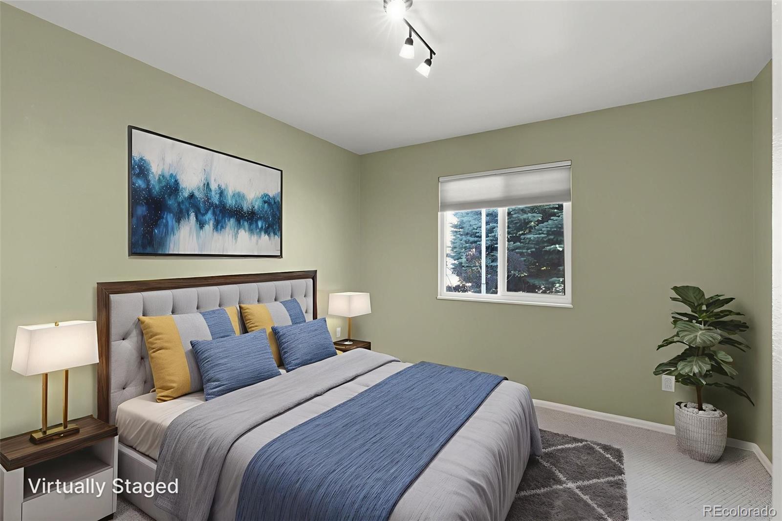 154 High Meadows Drive Florence, CO 81226 - Photo 13 of 27 a bedroom with a bed and a painting on the wall