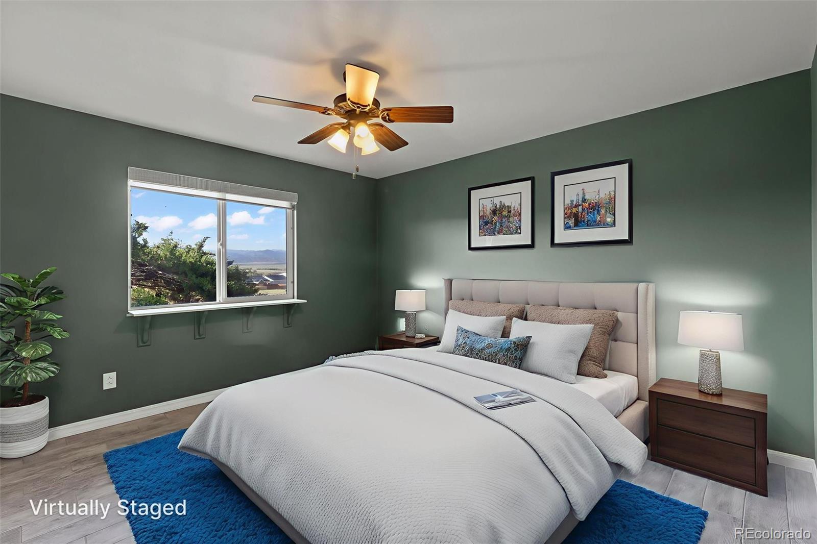 154 High Meadows Drive Florence, CO 81226 - Photo 16 of 27 a bedroom with a large bed and a window