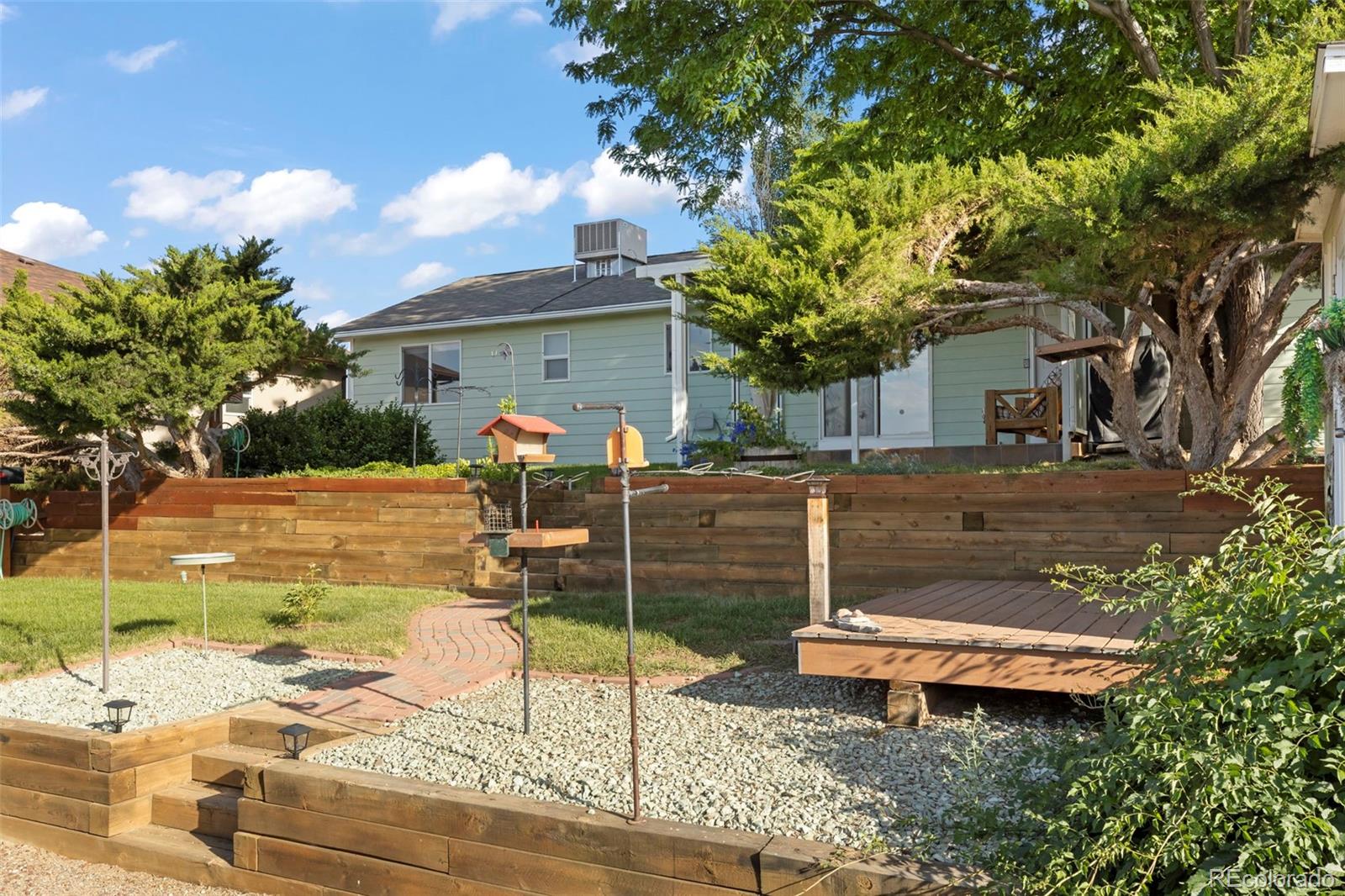 154 High Meadows Drive Florence, CO 81226 - Photo 23 of 27 a view of a backyard with sitting area