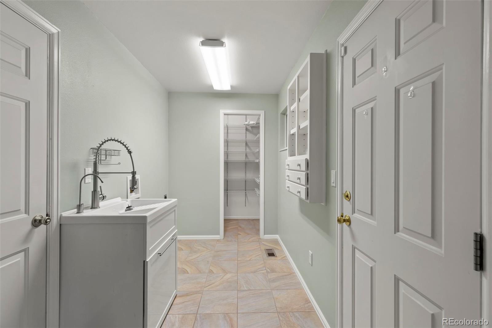 154 High Meadows Drive Florence, CO 81226 - Photo 7 of 27 a bathroom with a sink and mirror