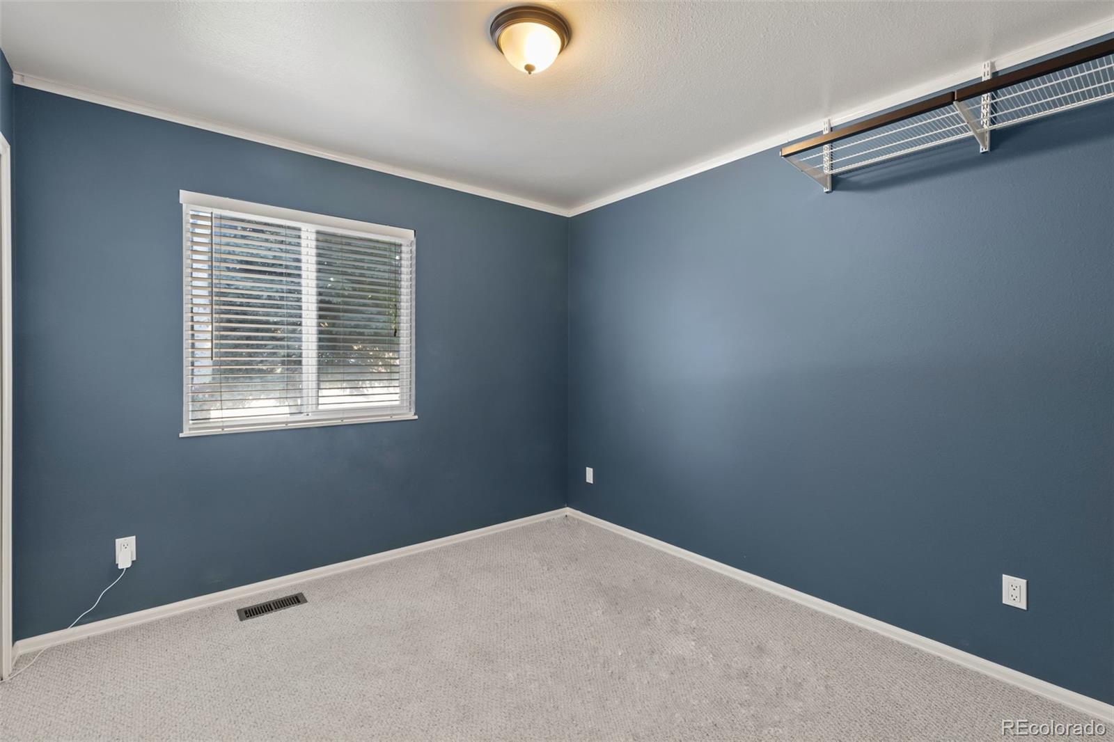 154 High Meadows Drive Florence, CO 81226 - Photo 9 of 27 a view of an empty room with a window