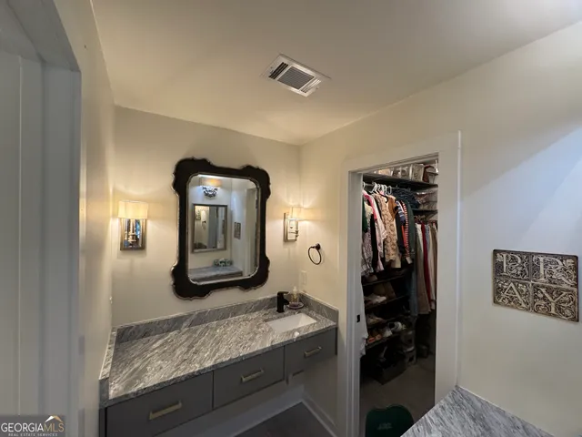 a room with closet and mirror