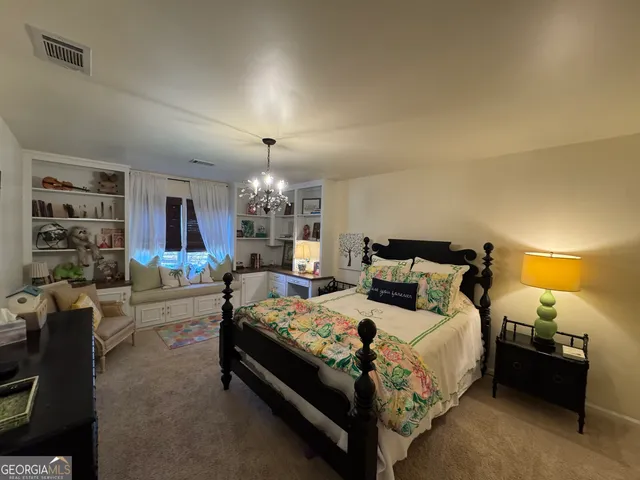 a bed room with a bed and furniture