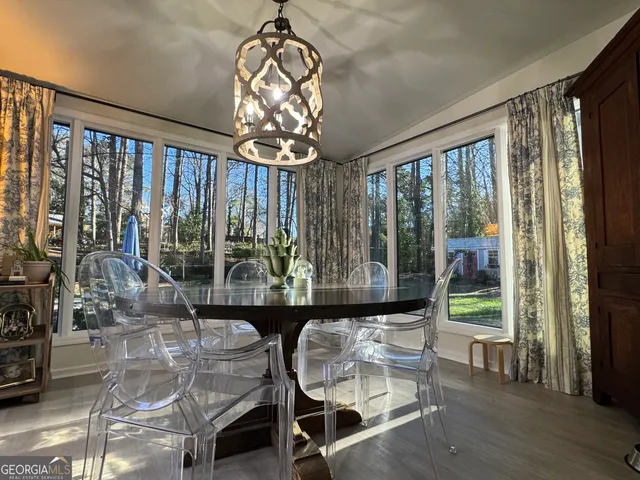 a view of a dining room with furniture window and outside view