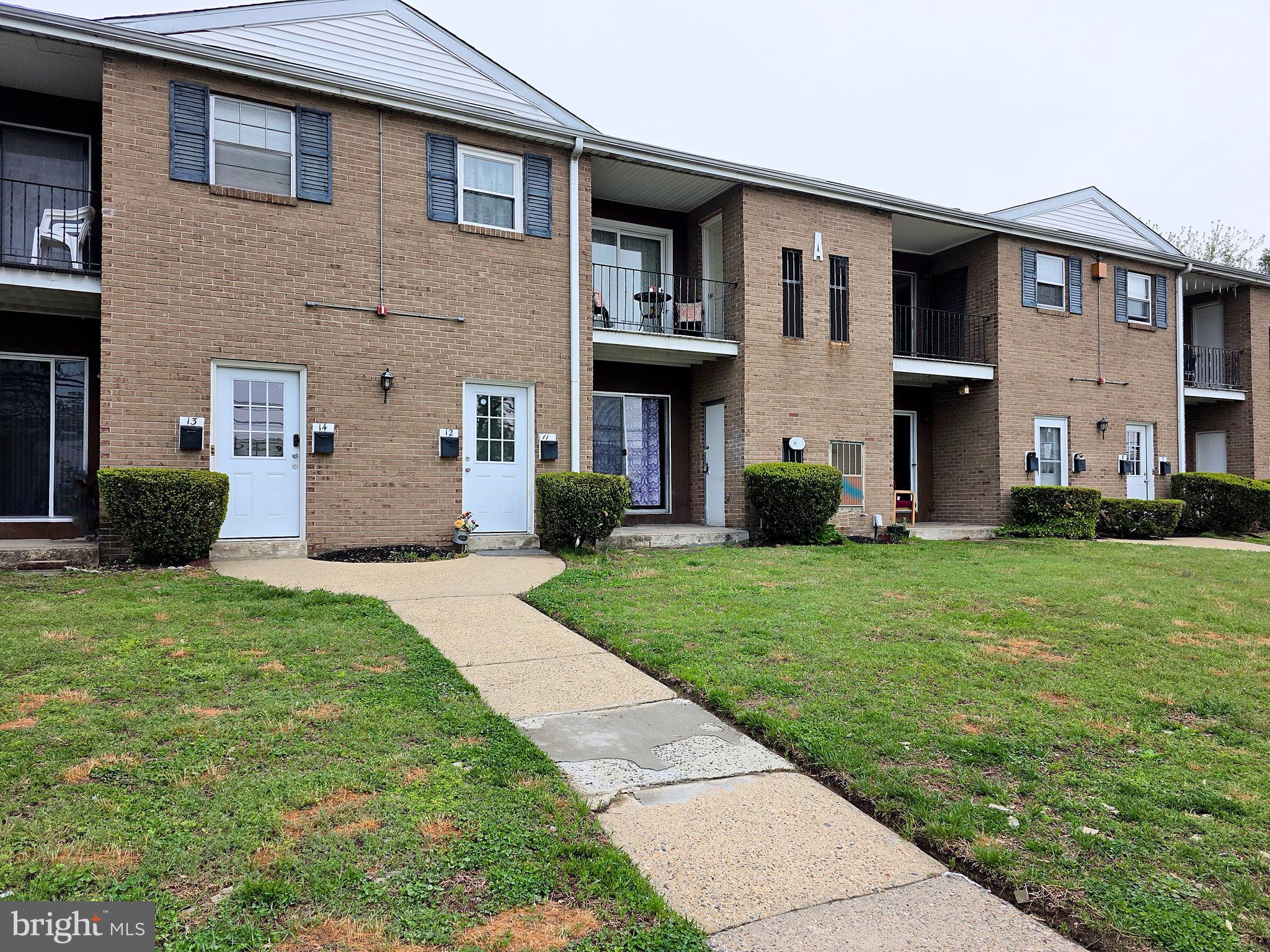 1294 Cooper Street, Unit A11 Beverly, NJ 08010 - Photo 1 of 10 a front view of house with yard