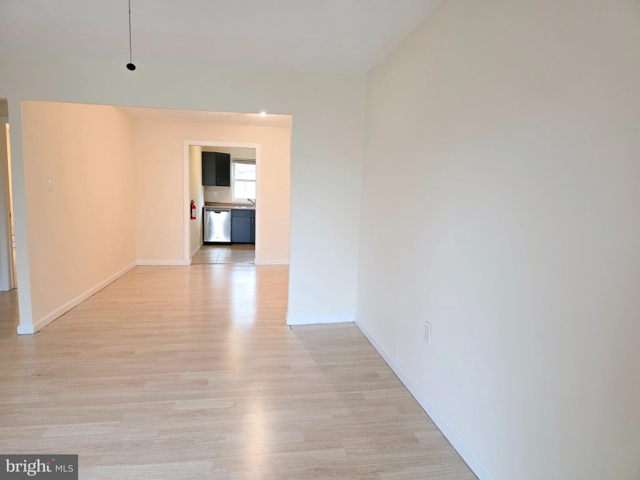 1294 Cooper Street, Unit A11 Beverly, NJ 08010 - Photo 7 of 10 a view of a hallway with wooden floor