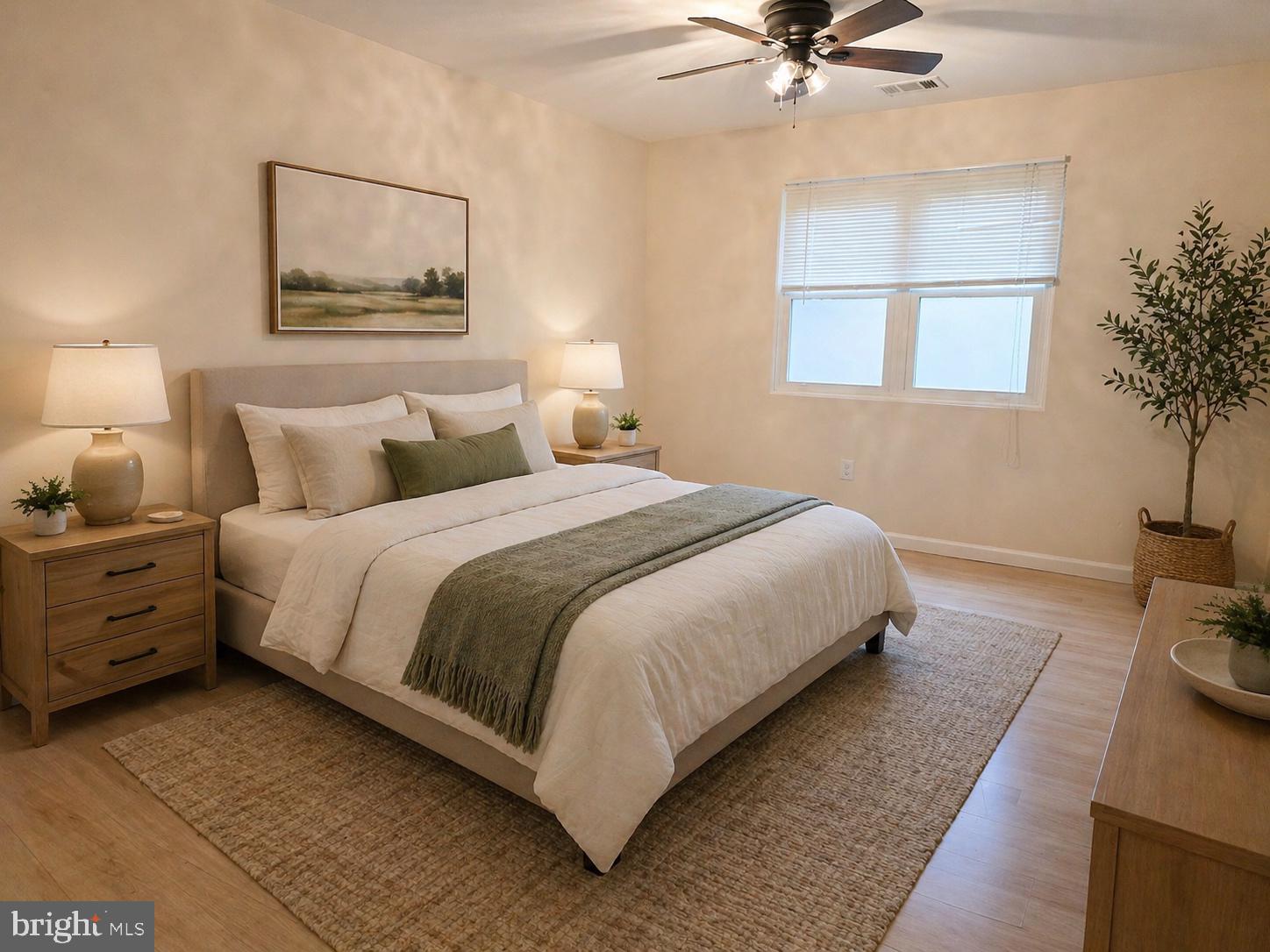 1294 Cooper Street, Unit A11 Beverly, NJ 08010 - Photo 8 of 10 a bedroom with a bed and a potted plant