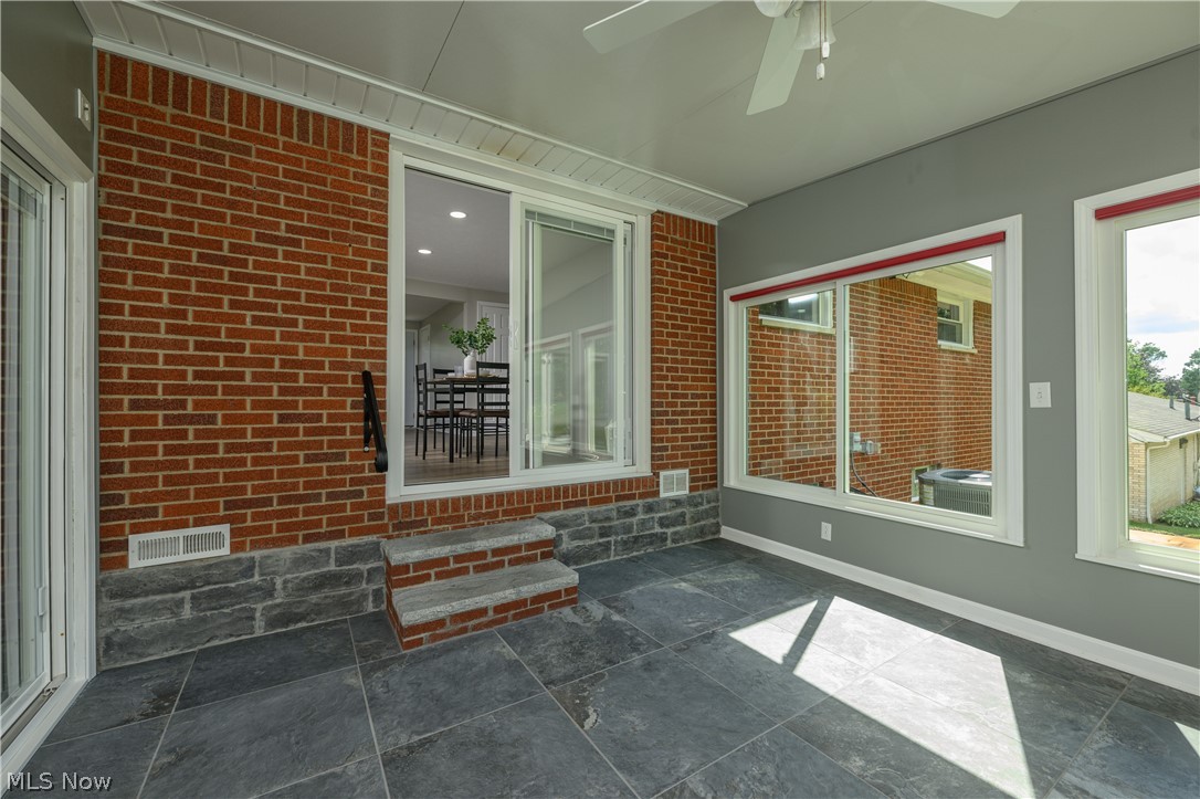 4855 4th Street Northwest Canton, OH 44708 - Photo 16 of 25 Unfurnished sunroom featuring ceiling fan