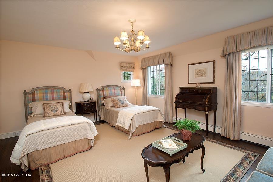 21 Konittekock Road Greenwich, CT 06831 - Photo 15 of 23 a bedroom with two beds and a dresser