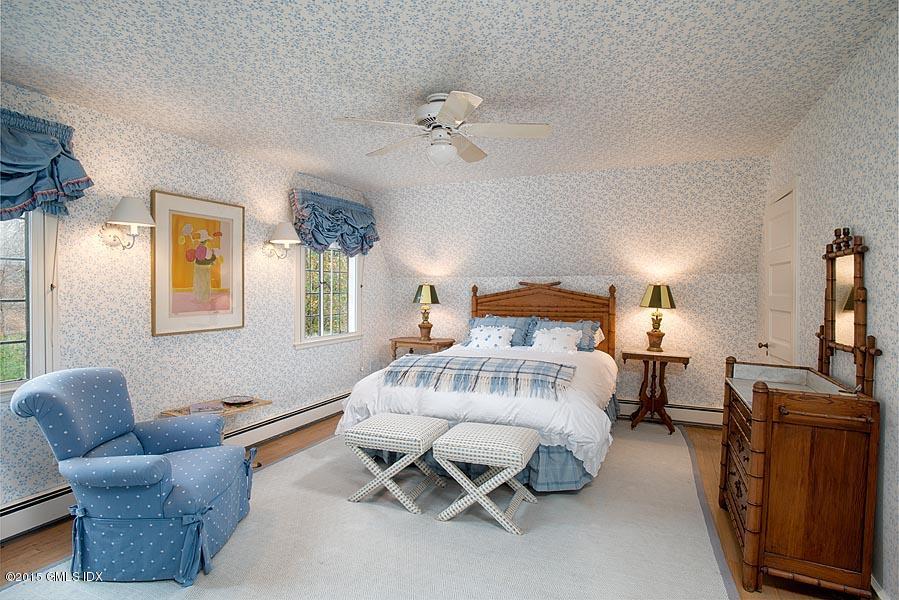 21 Konittekock Road Greenwich, CT 06831 - Photo 16 of 23 a bedroom with furniture and a window