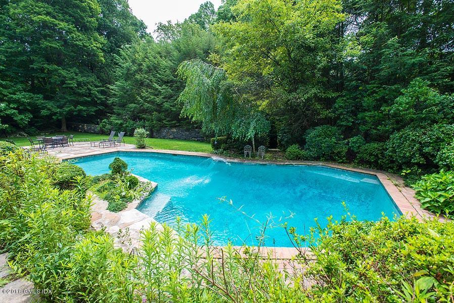 21 Konittekock Road Greenwich, CT 06831 - Photo 18 of 23 a view of a swimming pool with a yard