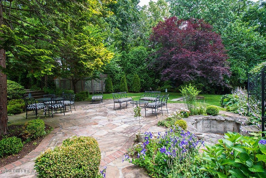 21 Konittekock Road Greenwich, CT 06831 - Photo 19 of 23 a view of backyard with sitting area and garden