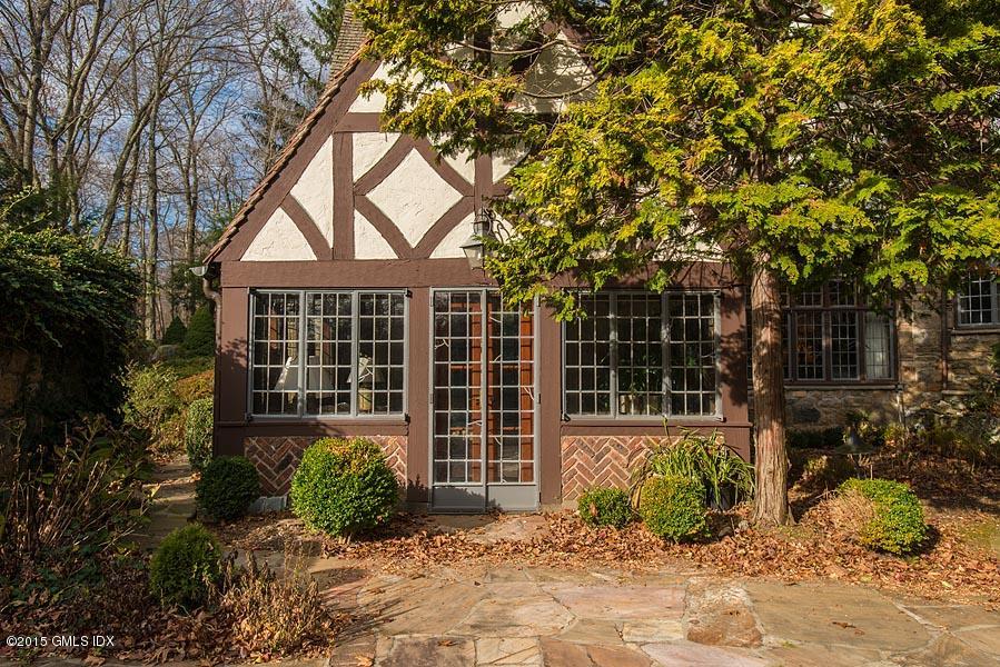 21 Konittekock Road Greenwich, CT 06831 - Photo 22 of 23 a front view of a house with garden