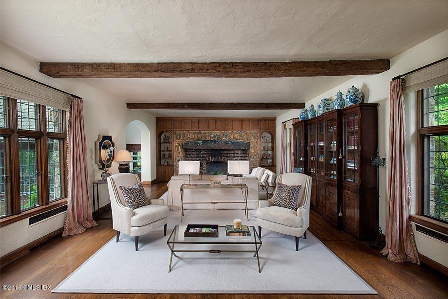 21 Konittekock Road Greenwich, CT 06831 - Photo 6 of 23 a living room with furniture a rug and a fireplace