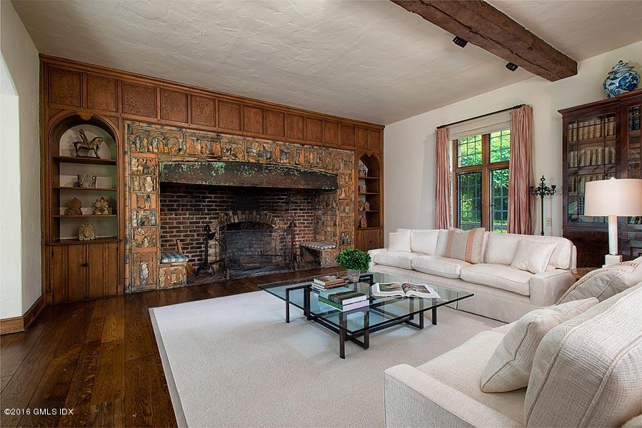 21 Konittekock Road Greenwich, CT 06831 - Photo 7 of 23 a living room with furniture and a fireplace