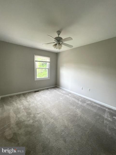 110 Autumn Hill Way Gaithersburg, MD 20877 - Photo 18 of 31 an empty room with windows and chandelier fan