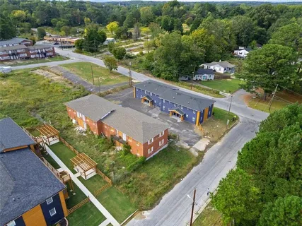 an aerial view of a house with a garden