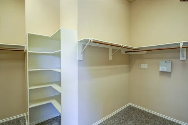 a view of an empty walk in closet