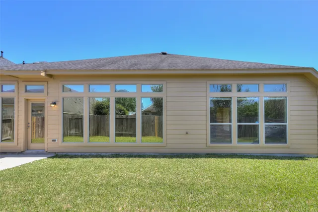 front view of a house with a large window