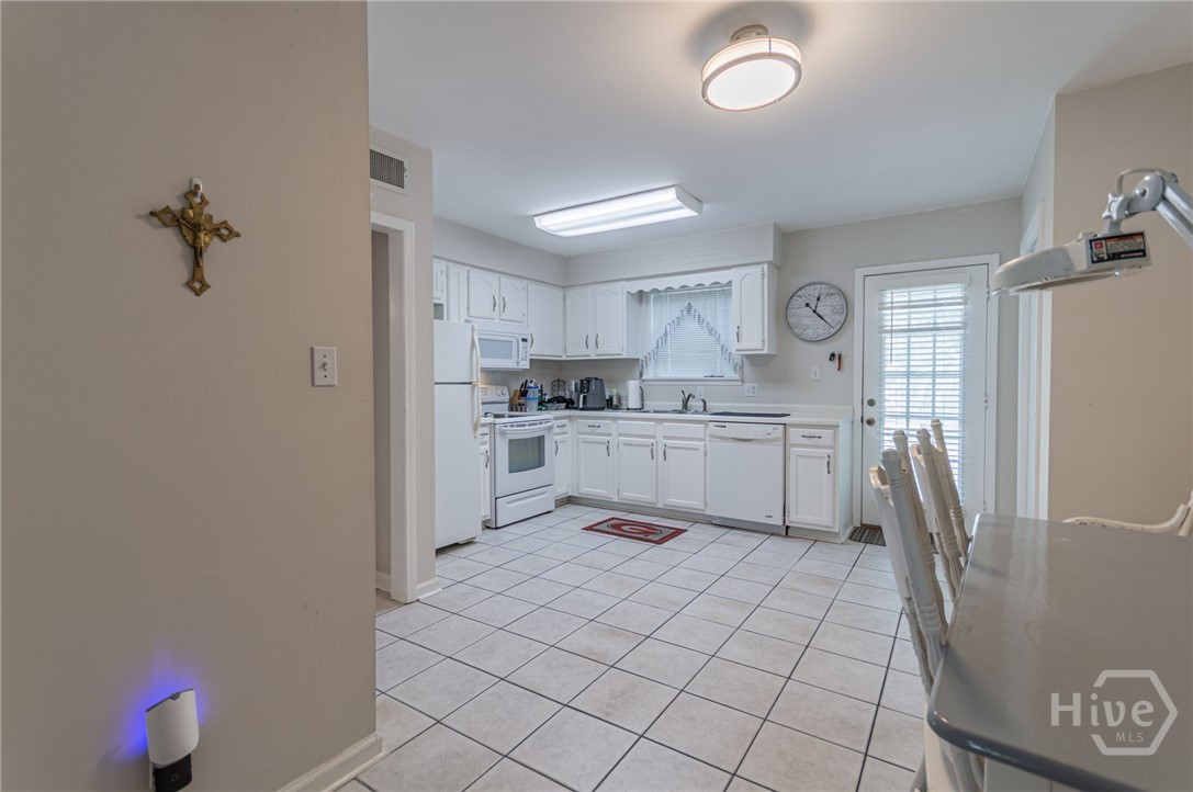 5 5th Avenue Tybee Island, GA 31328 - Photo 29 of 46 Downstairs kitchen with back door entrance.