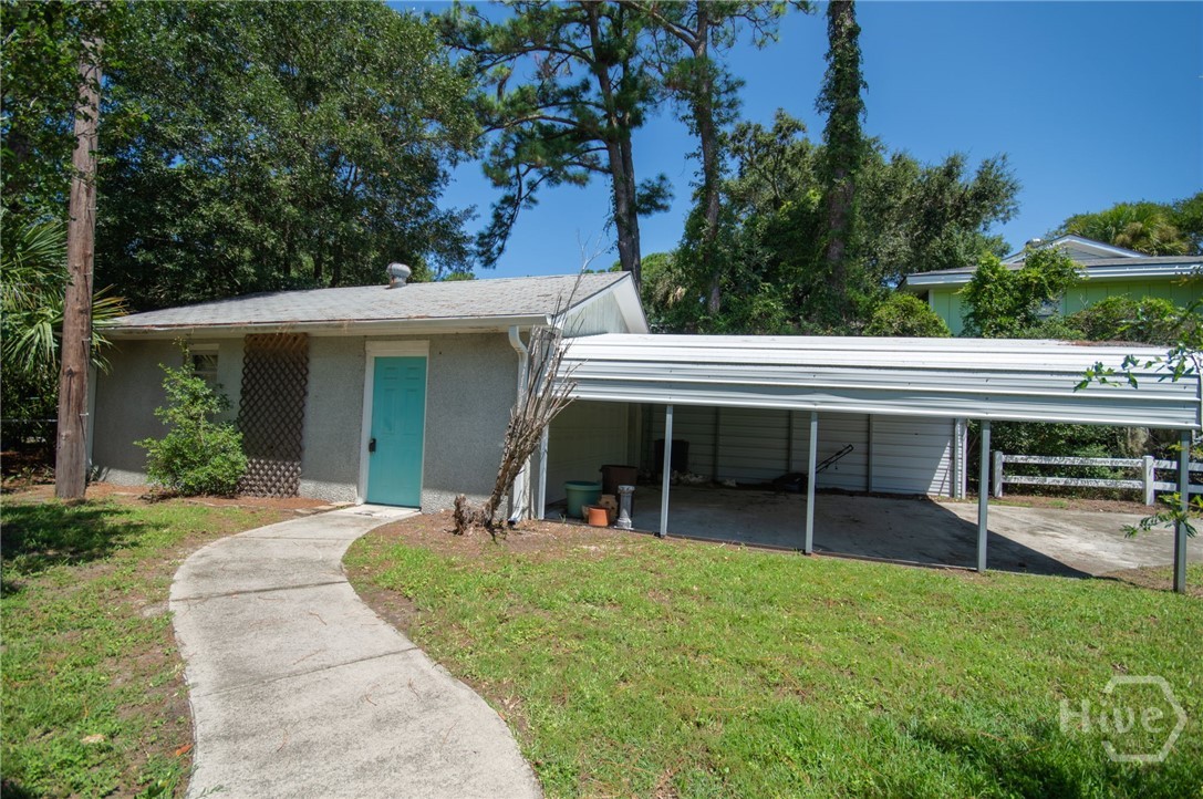 5 5th Avenue Tybee Island, GA 31328 - Photo 41 of 46 Detached garage with with carport with separate driveway.