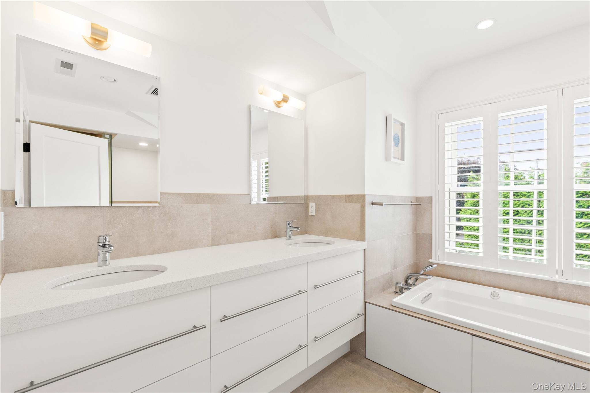 394 Park Avenue Rye, NY 10580 - Photo 18 of 36 Ensuite bathroom with radiant heated floor with twin vanity
