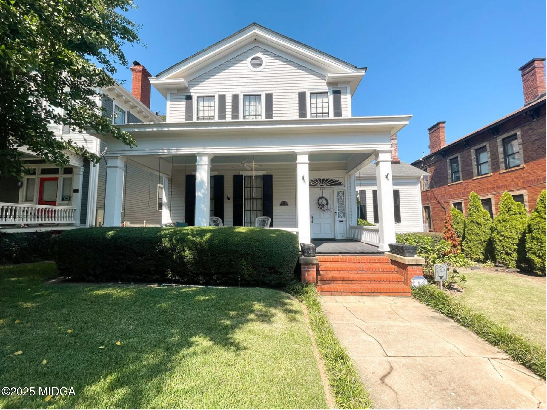 a front view of a house with a yard