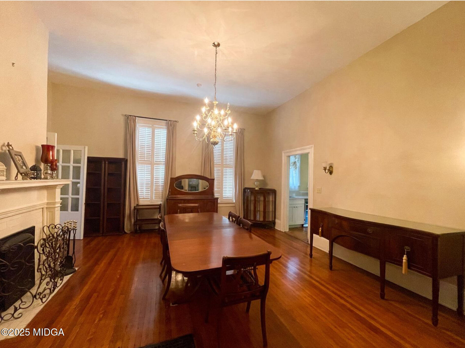 305 Orange Street Macon, GA 31201 - Photo 12 of 35 a dining room with furniture a chandelier and wooden floor