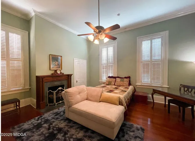 a living room with furniture a fireplace and a window