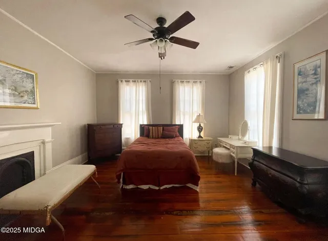 a bed room with furniture and a fireplace
