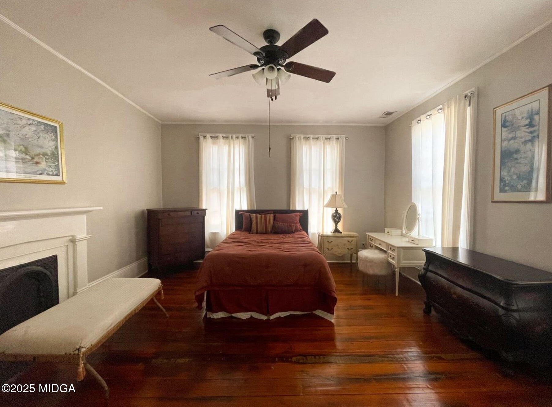 305 Orange Street Macon, GA 31201 - Photo 20 of 35 a bed room with furniture and a fireplace