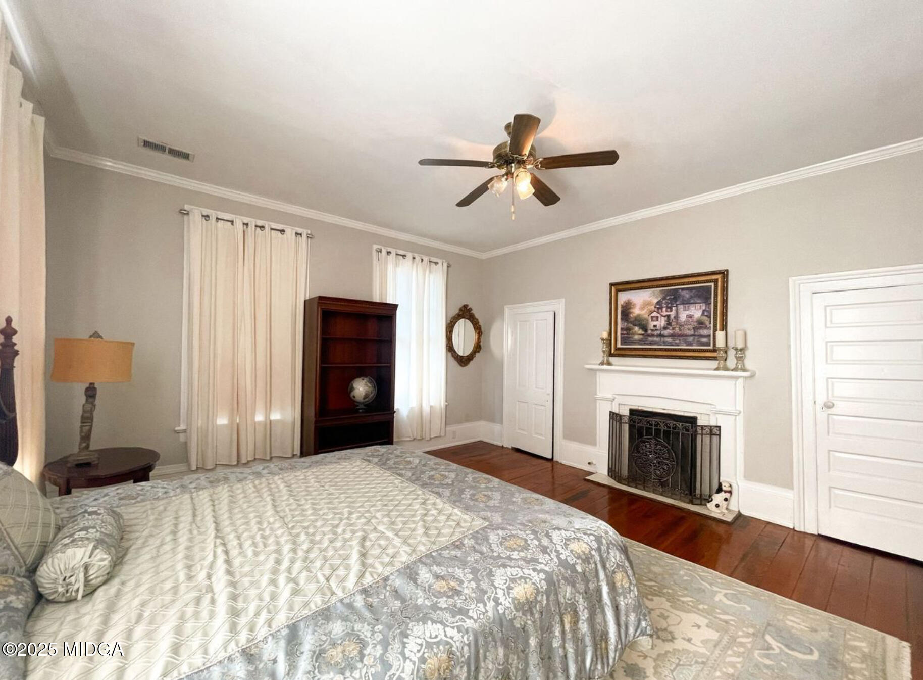 305 Orange Street Macon, GA 31201 - Photo 22 of 35 a bedroom with a bed and a fireplace