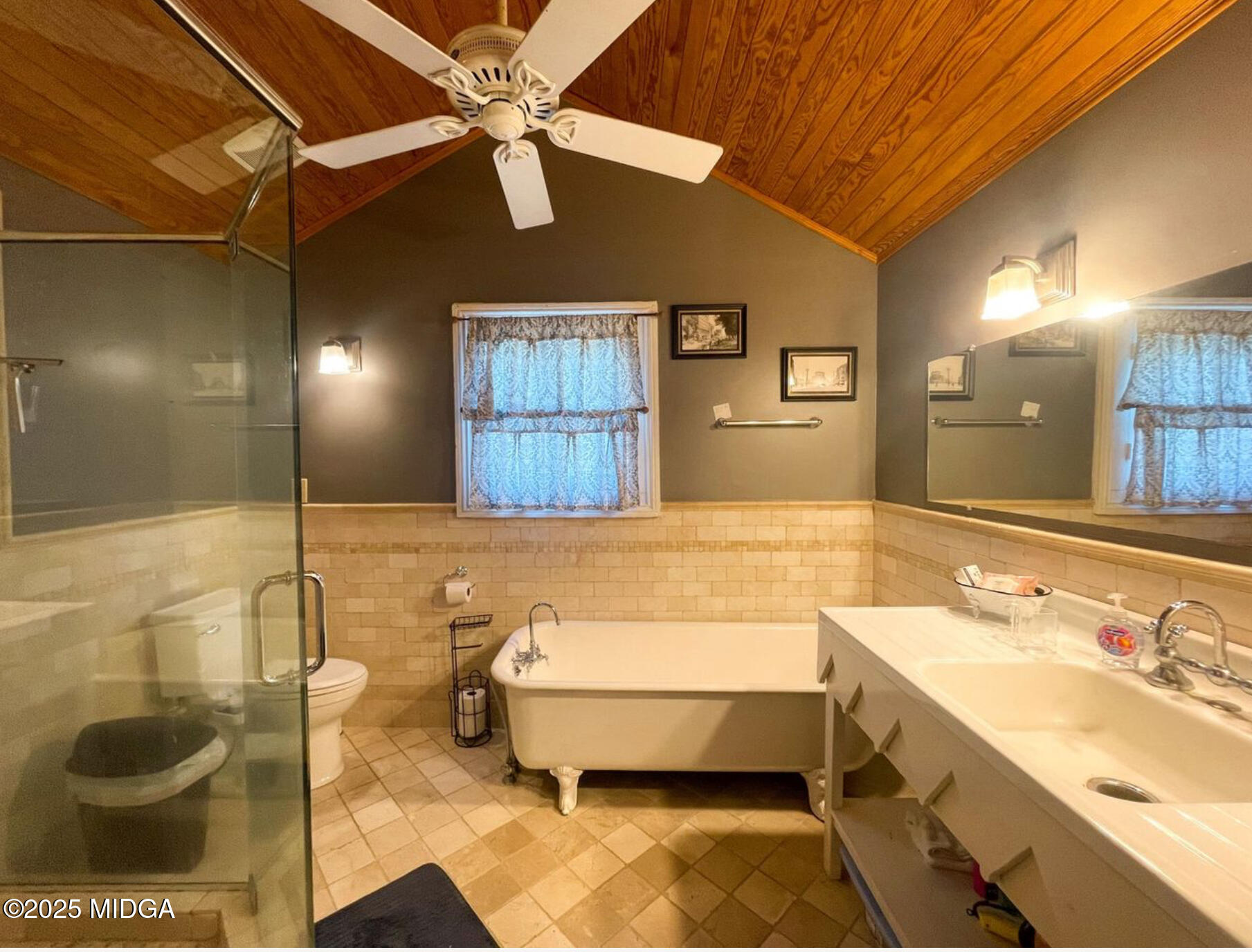 305 Orange Street Macon, GA 31201 - Photo 26 of 35 a bathroom with a sink and a mirror