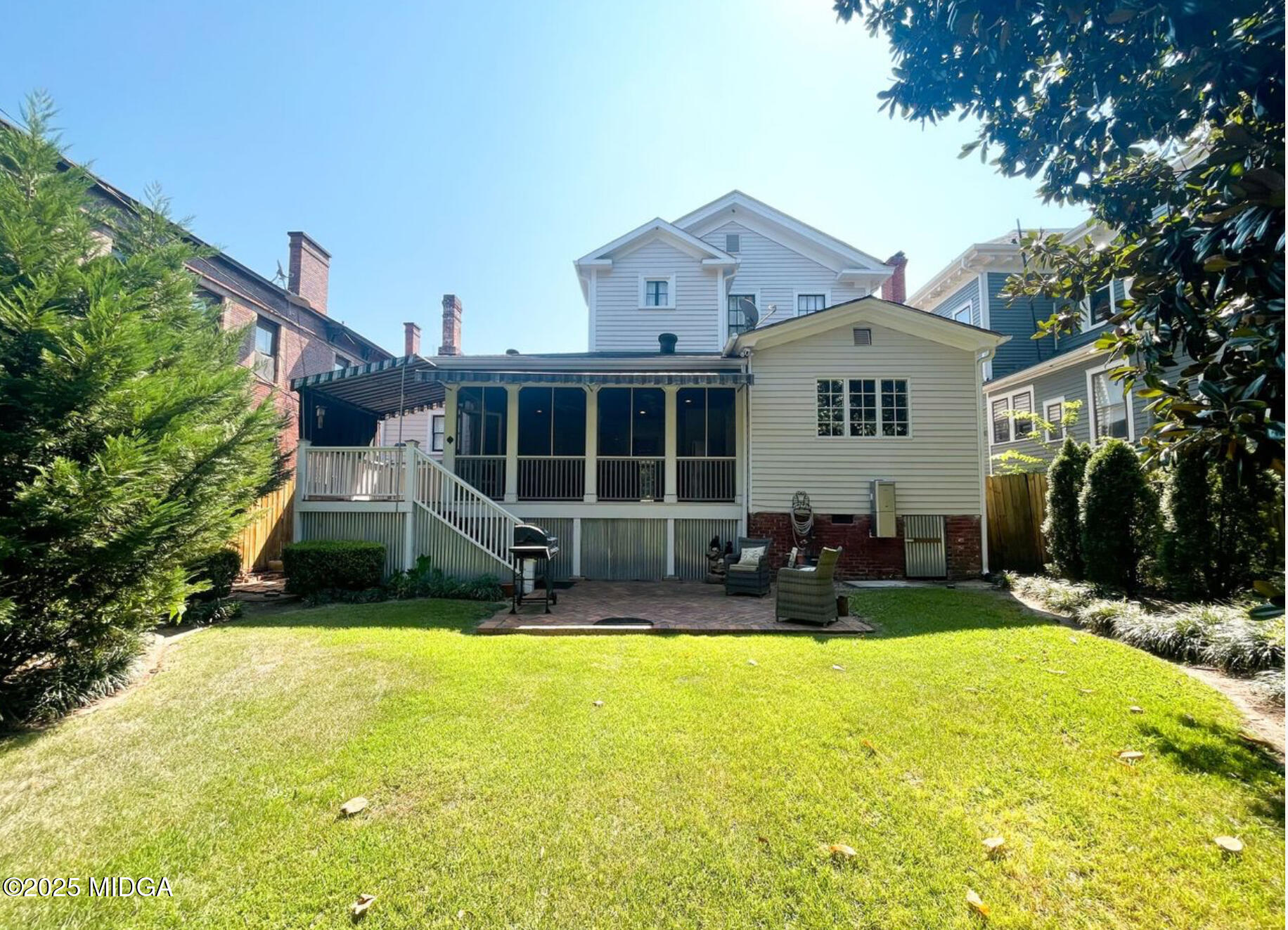 305 Orange Street Macon, GA 31201 - Photo 35 of 35 a view of a house with a patio and a yard