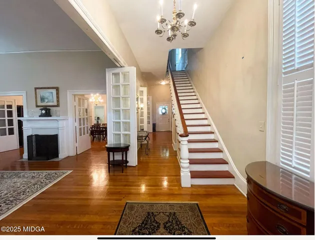 a view of an entryway with wooden floor