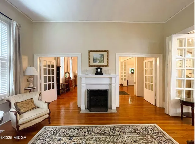 a living room with furniture and a fireplace