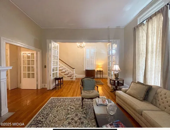 a living room with furniture and a table
