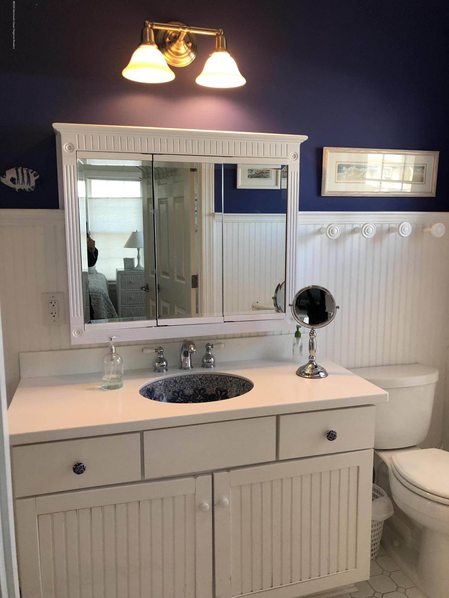 32 North Potter Avenue Manasquan, NJ 08736 - Photo 11 of 32 a bathroom with a sink and a mirror