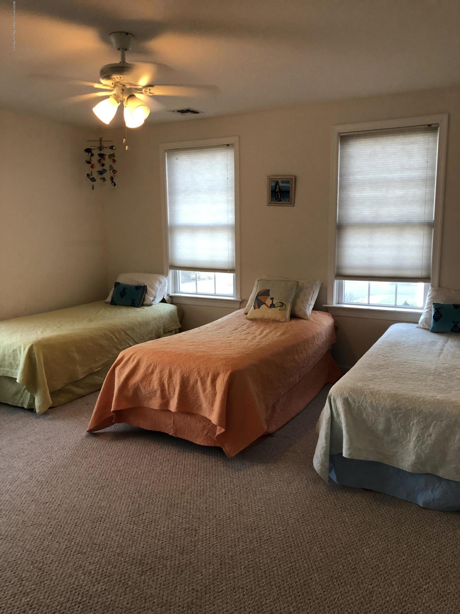 32 North Potter Avenue Manasquan, NJ 08736 - Photo 15 of 32 a bedroom with two beds and a window