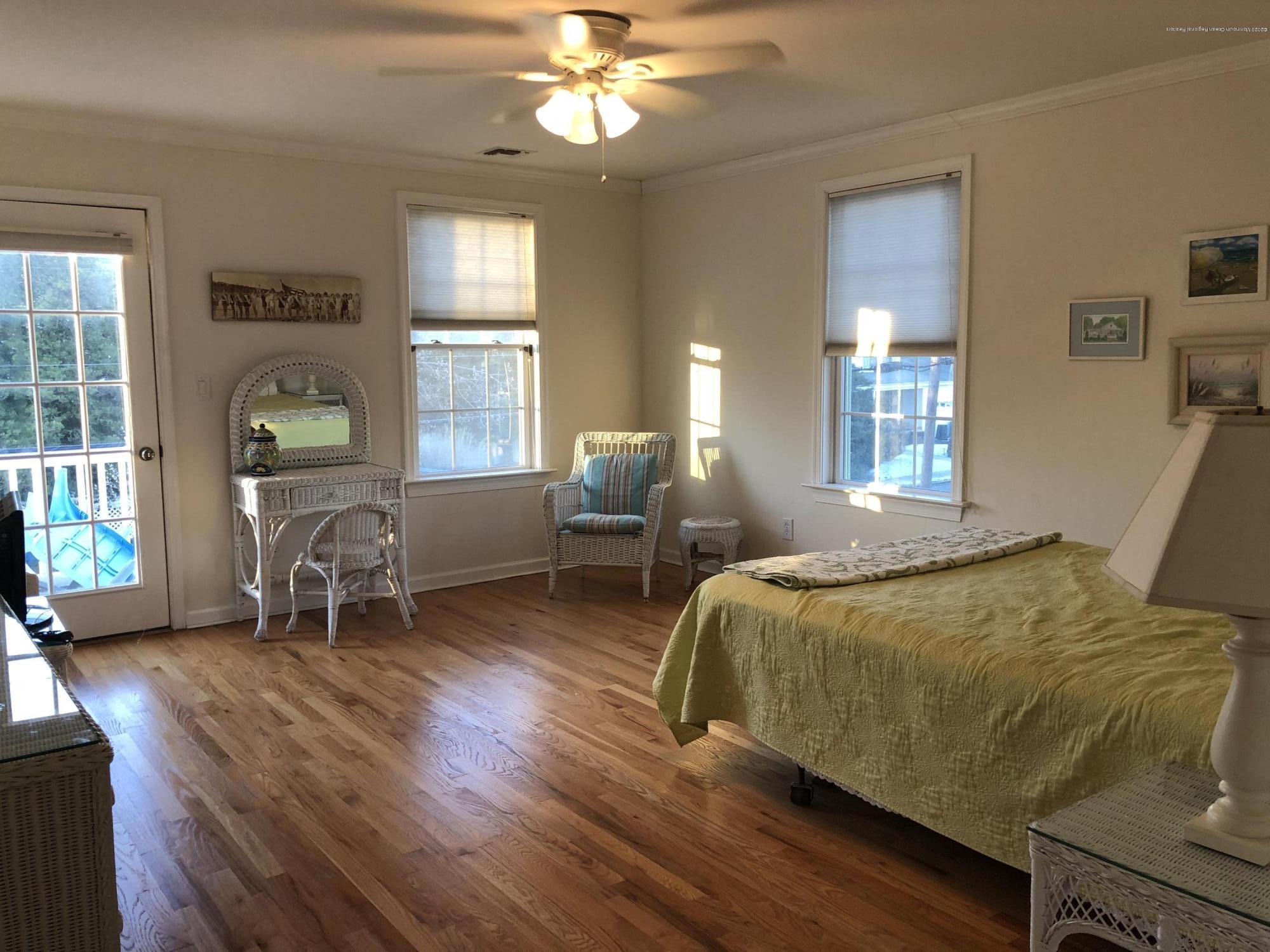 32 North Potter Avenue Manasquan, NJ 08736 - Photo 18 of 32 a bed room with a bed and a chair