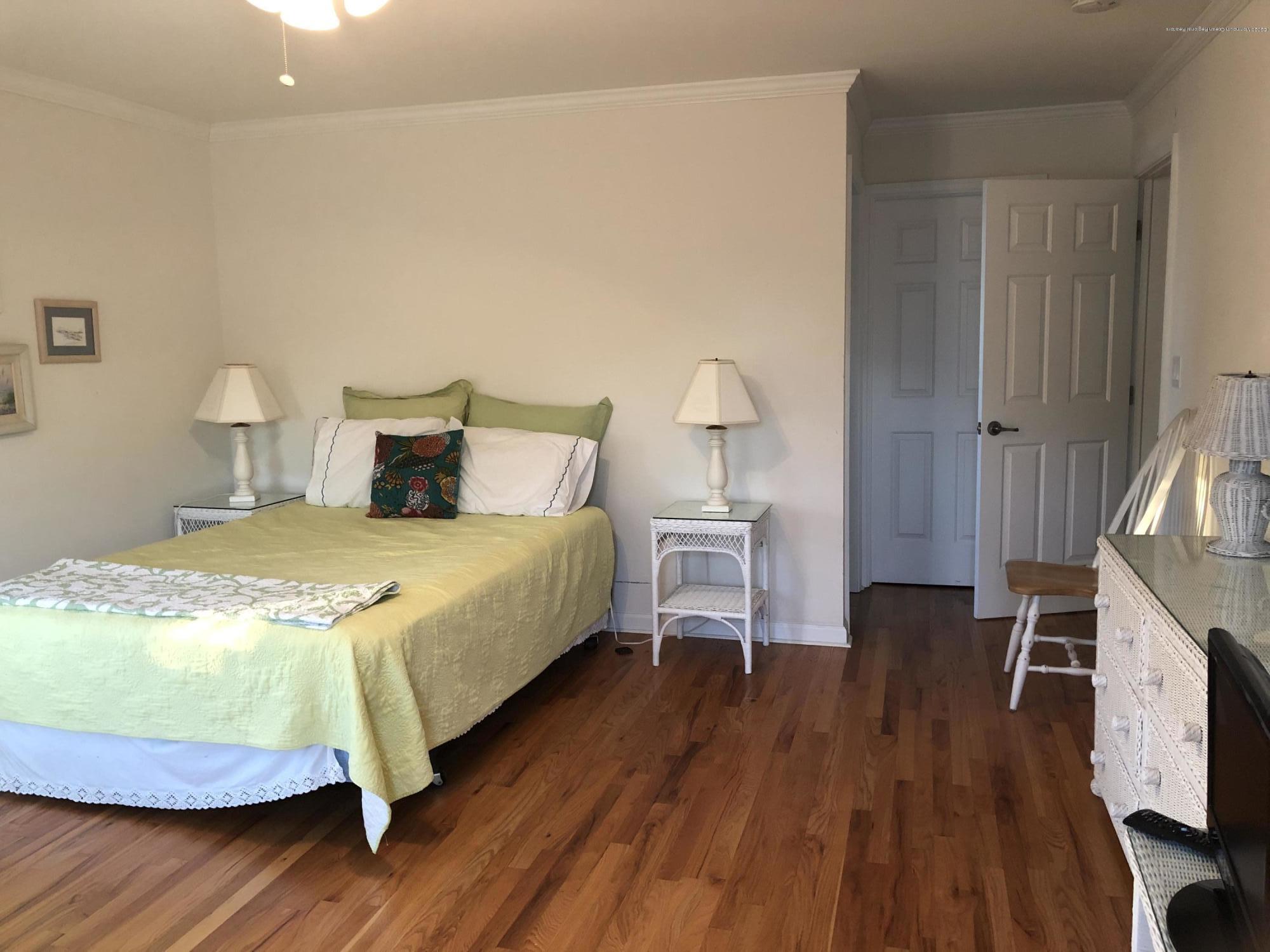 32 North Potter Avenue Manasquan, NJ 08736 - Photo 19 of 32 a bedroom with a bed and a flat tv screen on a dresser
