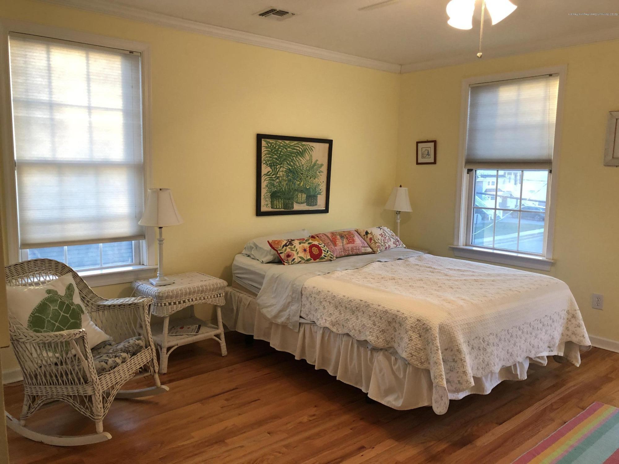 32 North Potter Avenue Manasquan, NJ 08736 - Photo 21 of 32 a bedroom with a bed a chair and a window