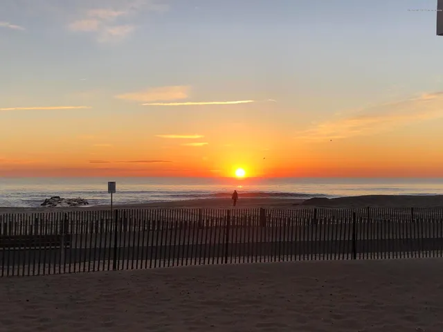 a view of a balcony with an ocean view