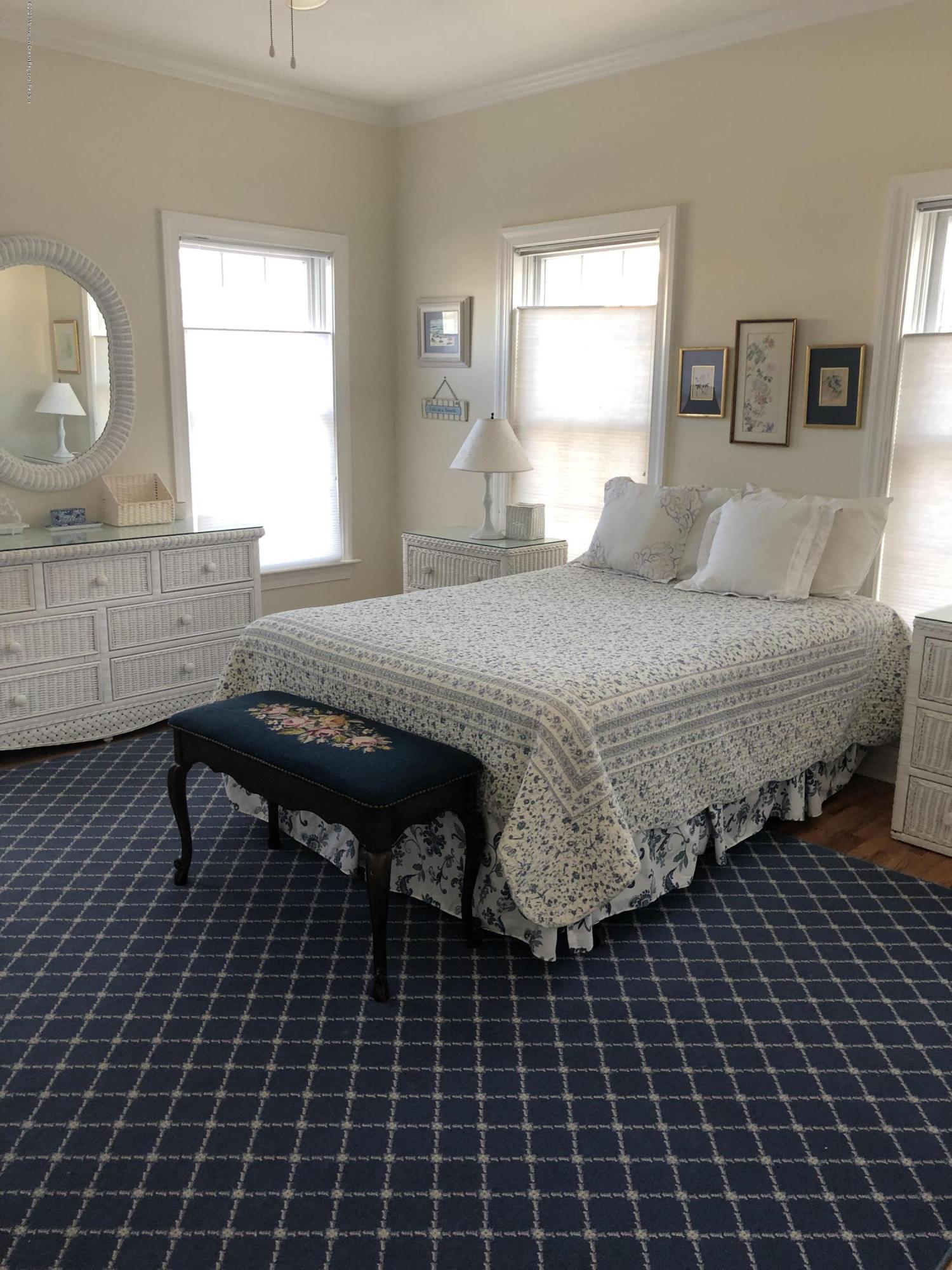 32 North Potter Avenue Manasquan, NJ 08736 - Photo 10 of 32 a bedroom with a bed and a window